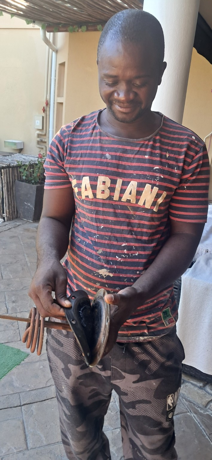 Lucky from Luciano Plumbing Specialist on site with removed geyser parts