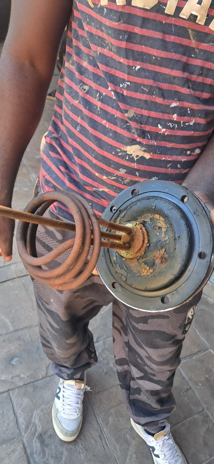 Removed geyser element with heavy corrosion and rust