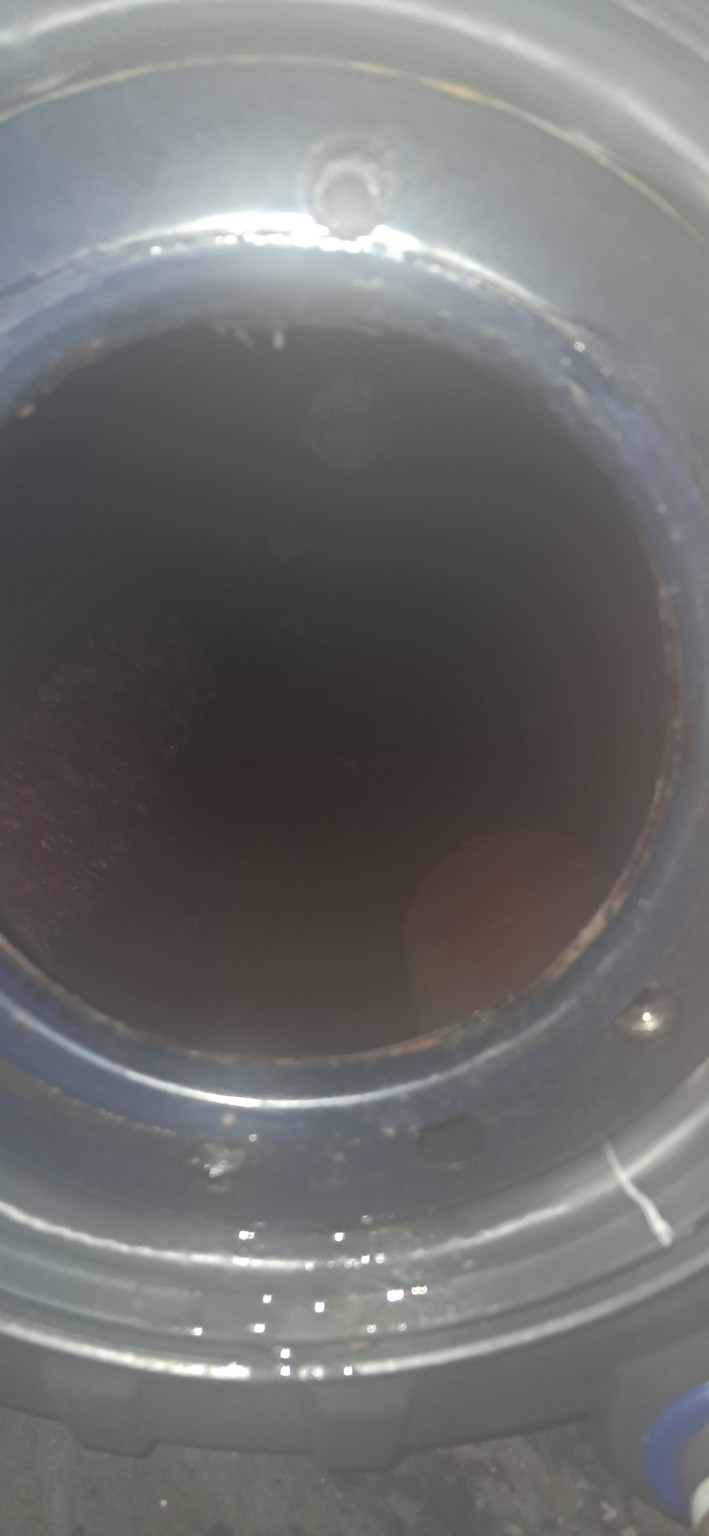 Dirty internal geyser water and contamination visible inside the tank